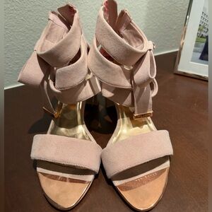 Ted Baker London pink suede heels with bow and gold accents.